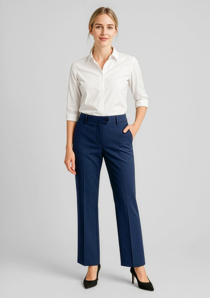 Women's wool stretch adjustable waist pants in navy, paired with a white shirt, featuring a front pocket and slight flare.