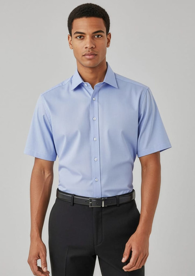 A light blue short sleeve button-up shirt, featuring a collar and a logo, worn with black trousers.