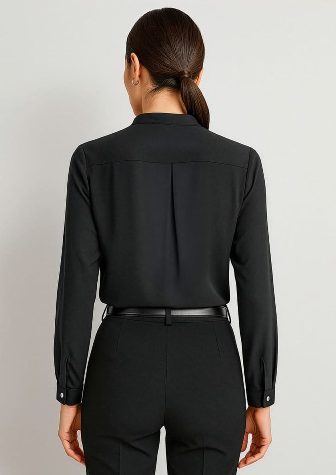 A black long sleeve blouse featuring a button-up design and a pleat detail at the back.