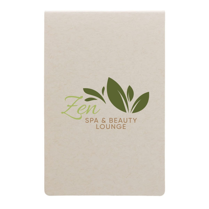 A cream-colored sticky note pad featuring a green logo with leaves and the text "Zen Spa & Beauty Lounge."