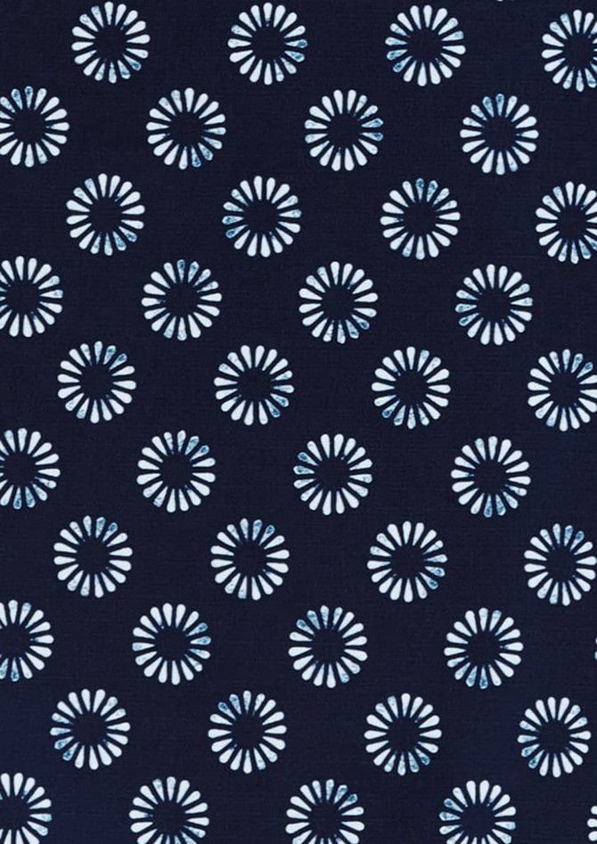 A navy button-up shirt featuring a white daisy print pattern, with a subtle branding logo.