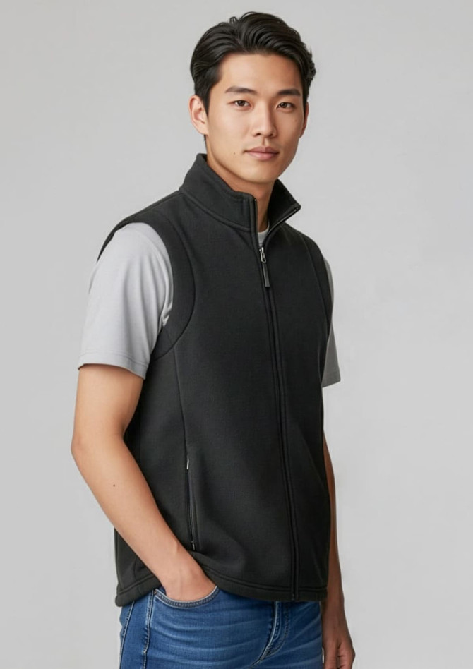 A black micro fleece vest for men with a zip front and side pockets, worn over a grey short-sleeve top.