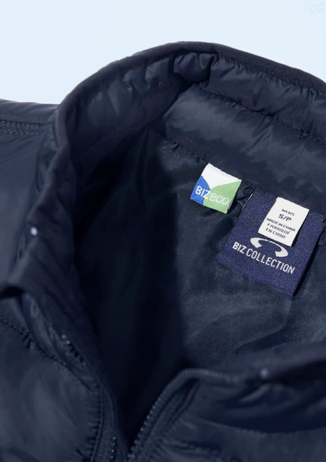 A navy men's alpine vest featuring a zip closure and an inner label with branding.