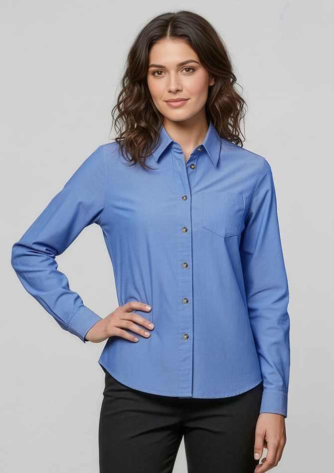 A women's long sleeve chambray button-up shirt in a light blue colour, featuring a collar and a single chest pocket.