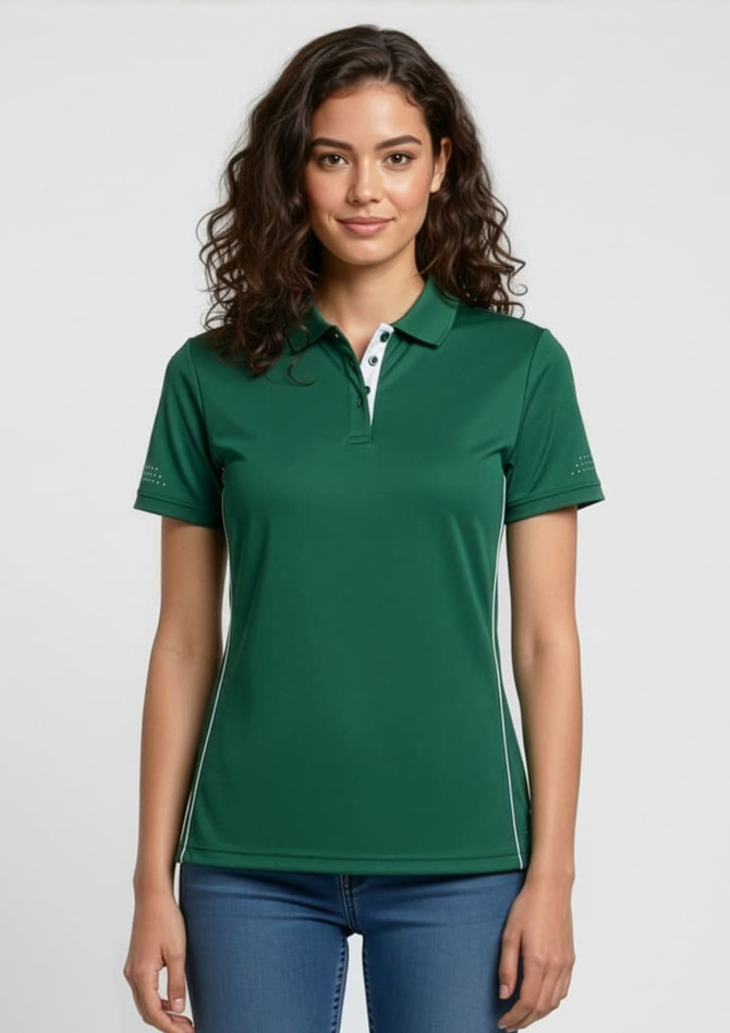 A green women's short sleeve polo shirt with a collar and branding, paired with light blue jeans.