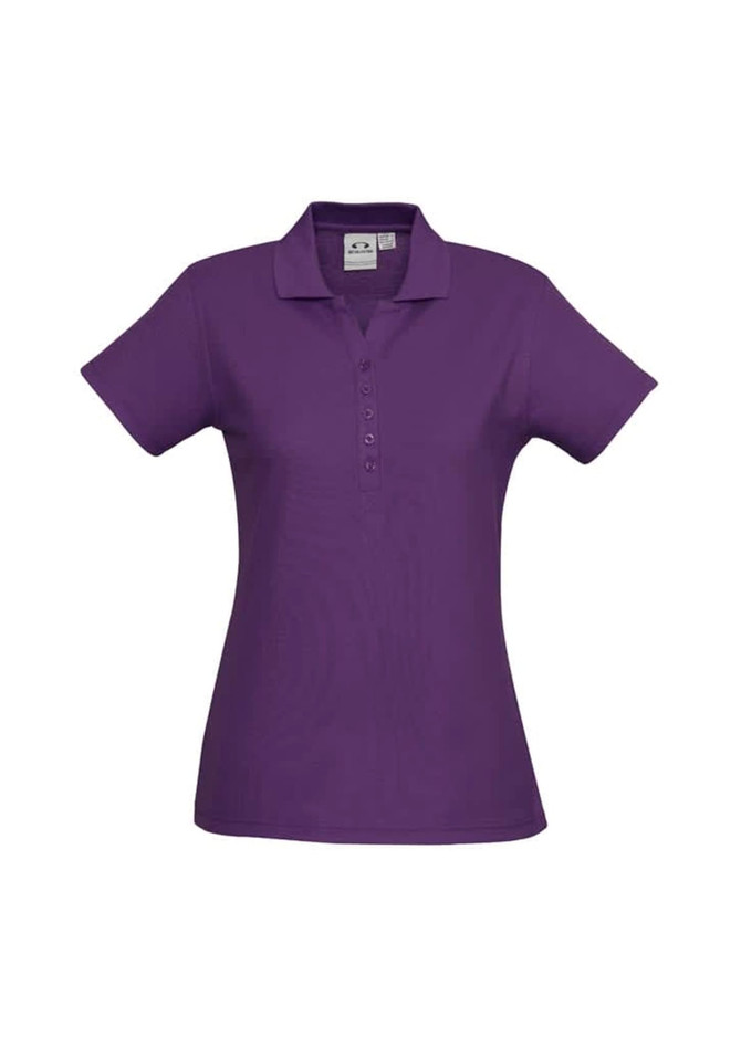 A purple ladies' polo shirt with a collared neck and button placket, featuring a logo on the chest.