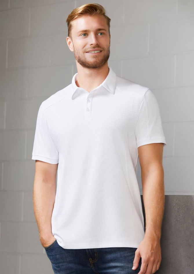 A white short sleeve polo shirt with a collar, featuring a brand logo, displayed on a male model.