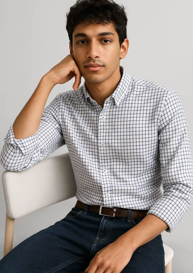 A long sleeve button-up shirt in a white and navy check pattern, featuring a classic collar.