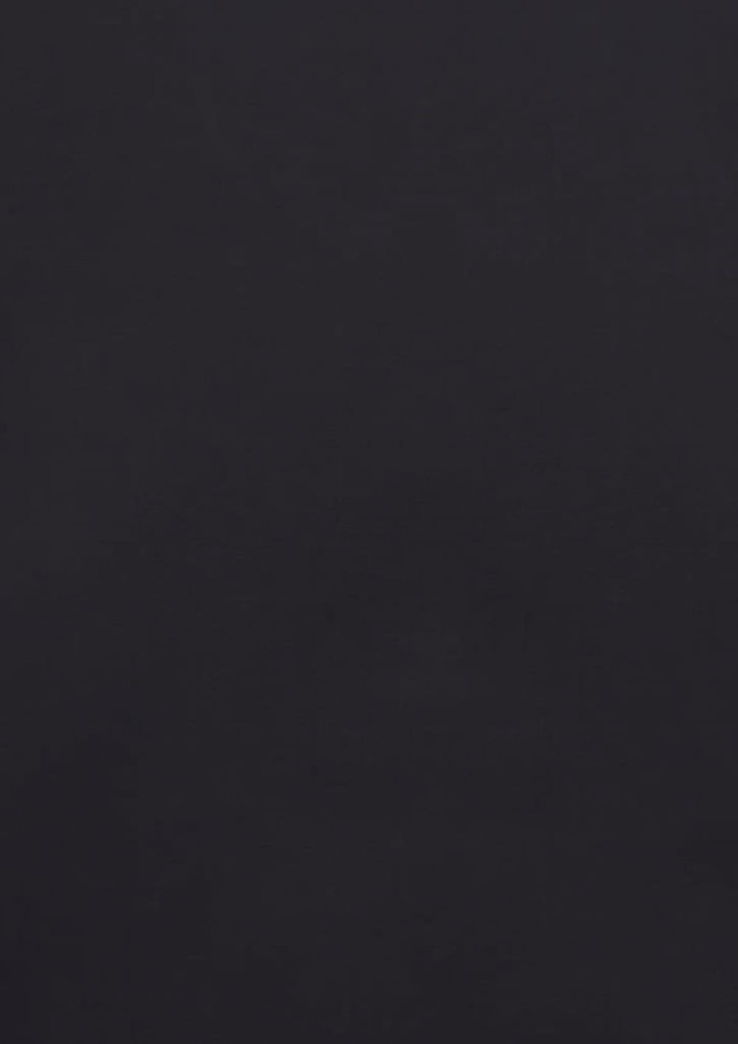A classic fit long sleeve shirt in a solid black colour, featuring a button-up front and a logo.