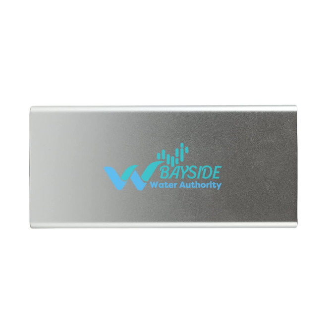 A power bank featuring a sleek silver design with the logo of the Bayside Water Authority printed in blue.