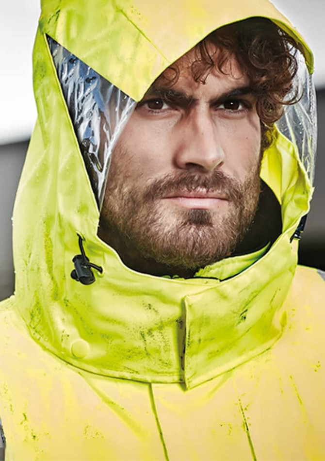 A waterproof jacket in bright yellow with an adjustable hood and clear panel, featuring a rugged design.