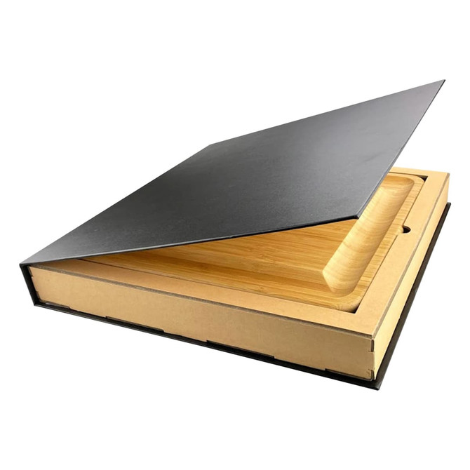 A bamboo cheeseboard with a knife set, contained in a stylish black box, showcasing a sleek design.