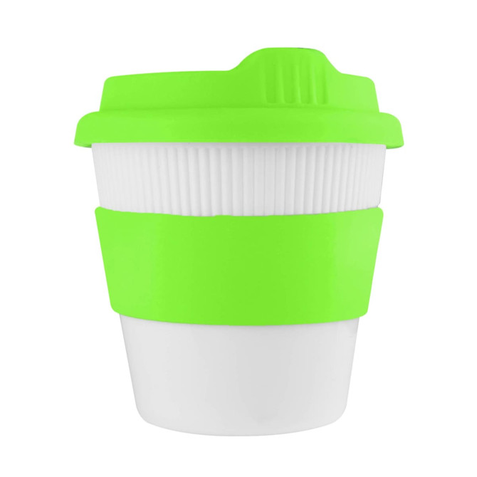 A reusable coffee cup in white with a bright green silicone lid and grip. Features a branding logo.
