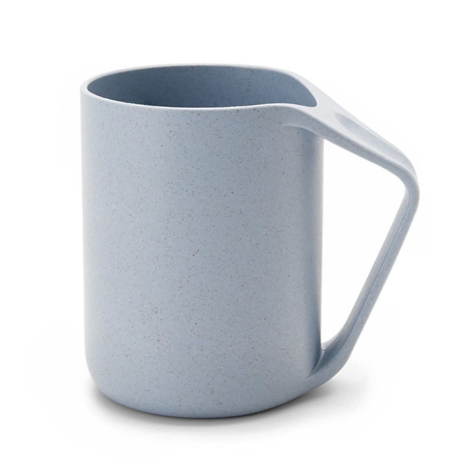 A reusable coffee cup in light blue, featuring a unique handle design and a textured surface. It has a logo.