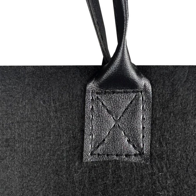 A black felt tote bag with a leather handle attachment, featuring decorative stitching. The bag has a simple, sleek design.