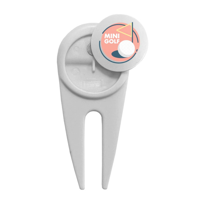 A white plastic golf divot repairer with a circular, multi-coloured logo on top. It includes a branding element.