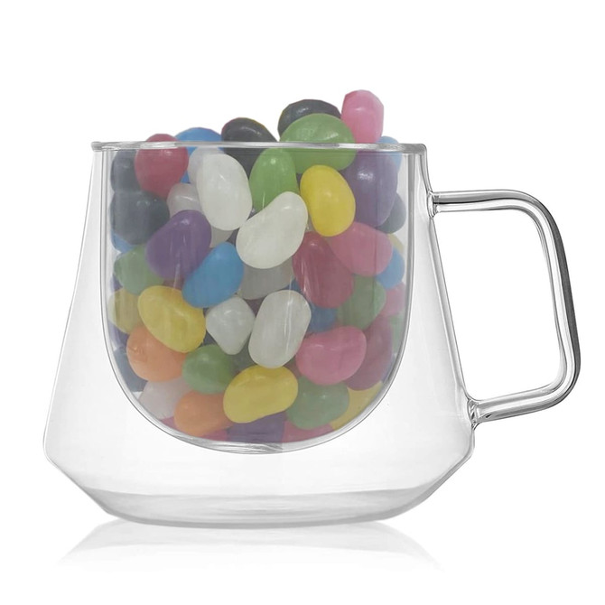 A clear coffee cup filled with colourful jelly beans, featuring a transparent design and a handle.