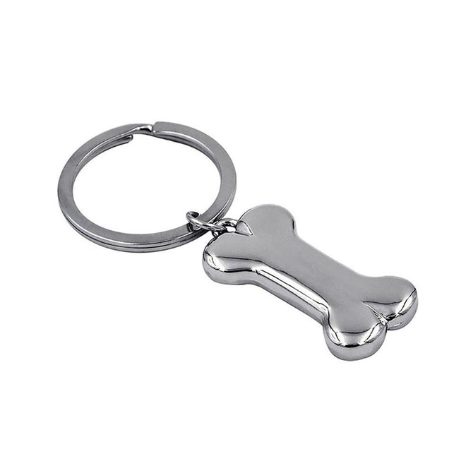 A silver bone-shaped key ring attached to a circular metal key chain. It has a shiny finish and includes a logo.