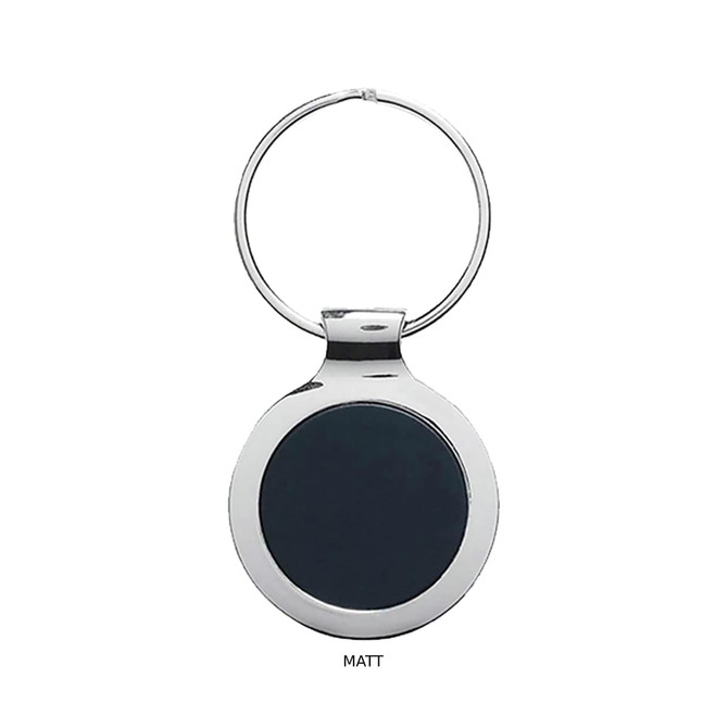 A matte black key ring with a polished silver metal rim and a circular design. It features a branding logo.
