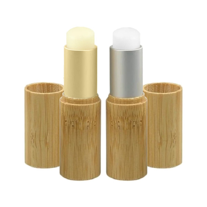 Two bamboo lip balm sticks, one silver and one gold, housed in natural bamboo containers.