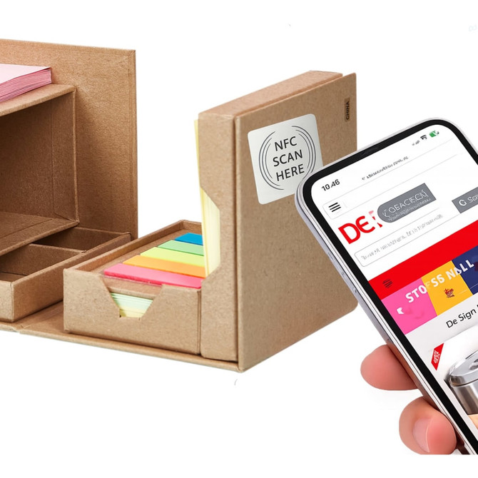 A desk organiser featuring a brown cardboard design holds an array of colourful sticky notes and has a smartphone nearby.