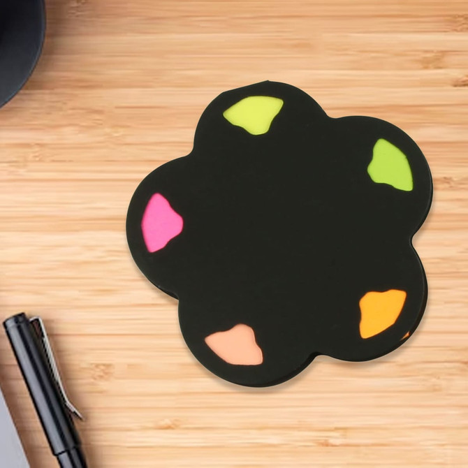 A black sticky note in a flower shape with pink, green, orange, and yellow coloured accents.