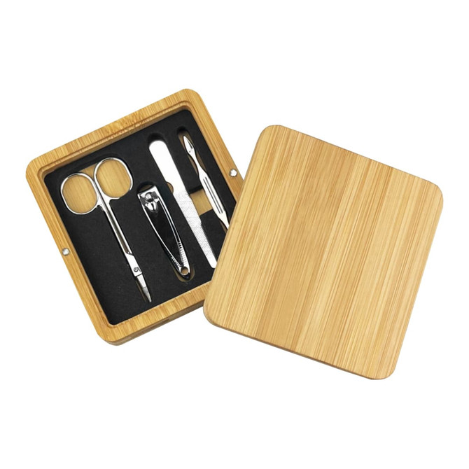 A bamboo manicure set featuring scissors, a nail clipper, and a file, housed in a sleek wooden case.