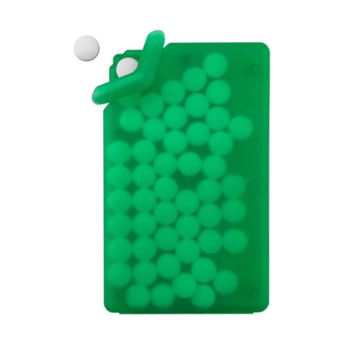 A green silicone card holder filled with white sugar-free mint tablets, with one tablet positioned above the holder.