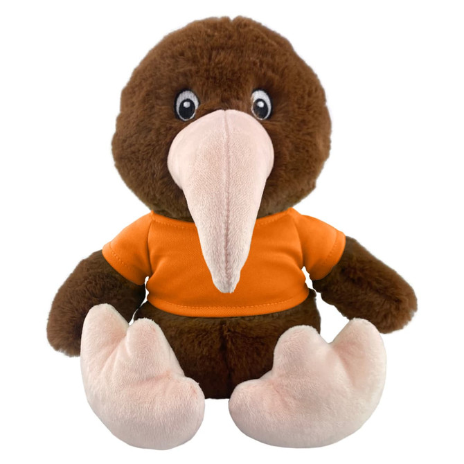 A brown kiwi plush toy with a large beak, wearing an orange shirt. It has white feet and bright, expressive eyes.