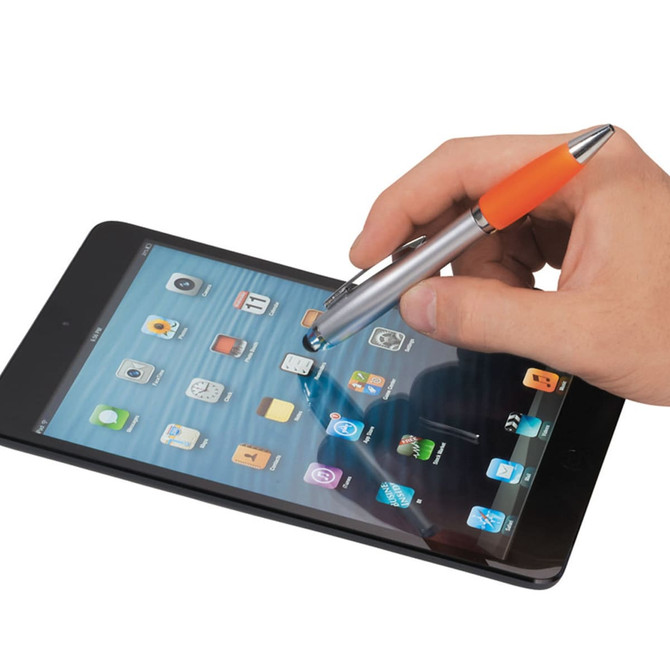 A stylus pen with a silver body and orange tip is being used on a black tablet screen, featuring app icons.