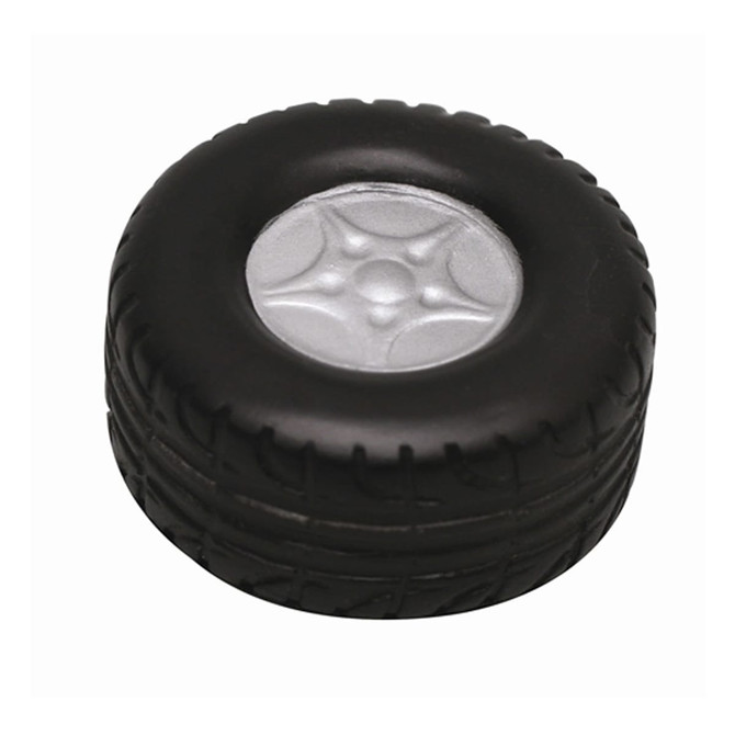 A black stress relief toy shaped like a tyre, featuring a silver rim in the centre. It has a textured surface.