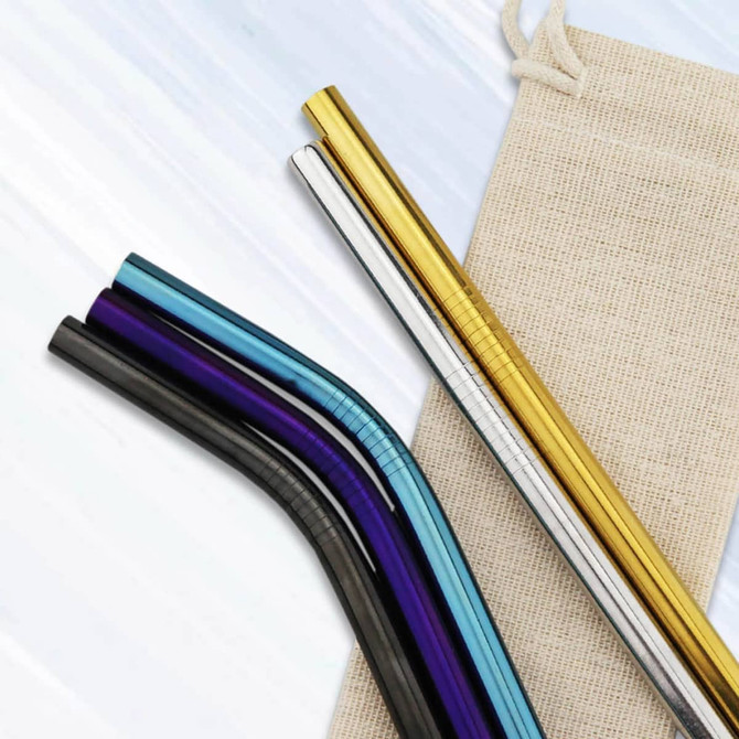 Stainless steel drinking straws in various colours, including gold, black, purple, blue, and silver, with a natural fabric pouch.
