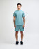 A unisex mockneck t-shirt in a soft green colour, featuring a relaxed fit and a logo.