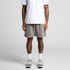 Relaxed grey track shorts with a subtle hem finish, styled on a person wearing a white t-shirt and sports shoes.