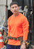 An orange long sleeve tee with a fitted design, suitable for safety wear, worn by a man on a construction site.
