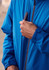 A blue unisex super light packable rain jacket with a zip and a logo on the chest.