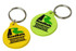 Two custom PVC keyrings in yellow and green, each featuring a logo and attached to a metal key ring.