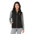 A black women's softshell vest with a zip front, featuring a logo, worn over a grey long-sleeve top.