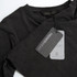 A faded black unisex T-shirt featuring a logo and a hang tag detailing care instructions.