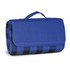 A blue and black checkered picnic blanket, neatly folded with a carry handle. Branding visible on the exterior.