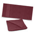 A maroon beach towel with a textured surface and a folded section, featuring a subtle logo.