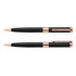 A set of black metal pens with rose gold accents, featuring a sleek design and a logo on the clip.