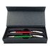 A gift box containing two plastic pens, one red and one green, with silver accents. The box has a sleek design and a logo.