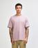 A model wearing a purple American Apparel Super Heavyweight T-Shirt, paired with olive green shorts.