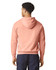 A lightweight hooded sweatshirt in a soft peach colour, featuring a hood and a simple design.
