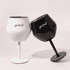 Two detachable wine glasses in black and white, featuring a logo on each, positioned together.