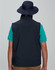 A navy blue surf hat with a clip-on chin strap, worn by a person from the back, paired with a teal shirt.