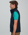 A men's softshell hi-tech vest in navy, featuring a fitted design and a logo on the chest.