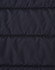 A close-up of a navy blue insulated puffer jacket fabric with a stitched, quilted pattern and a logo.