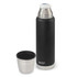 A drink bottle in matte black with a stainless steel top, accompanied by a matching stainless steel cup.